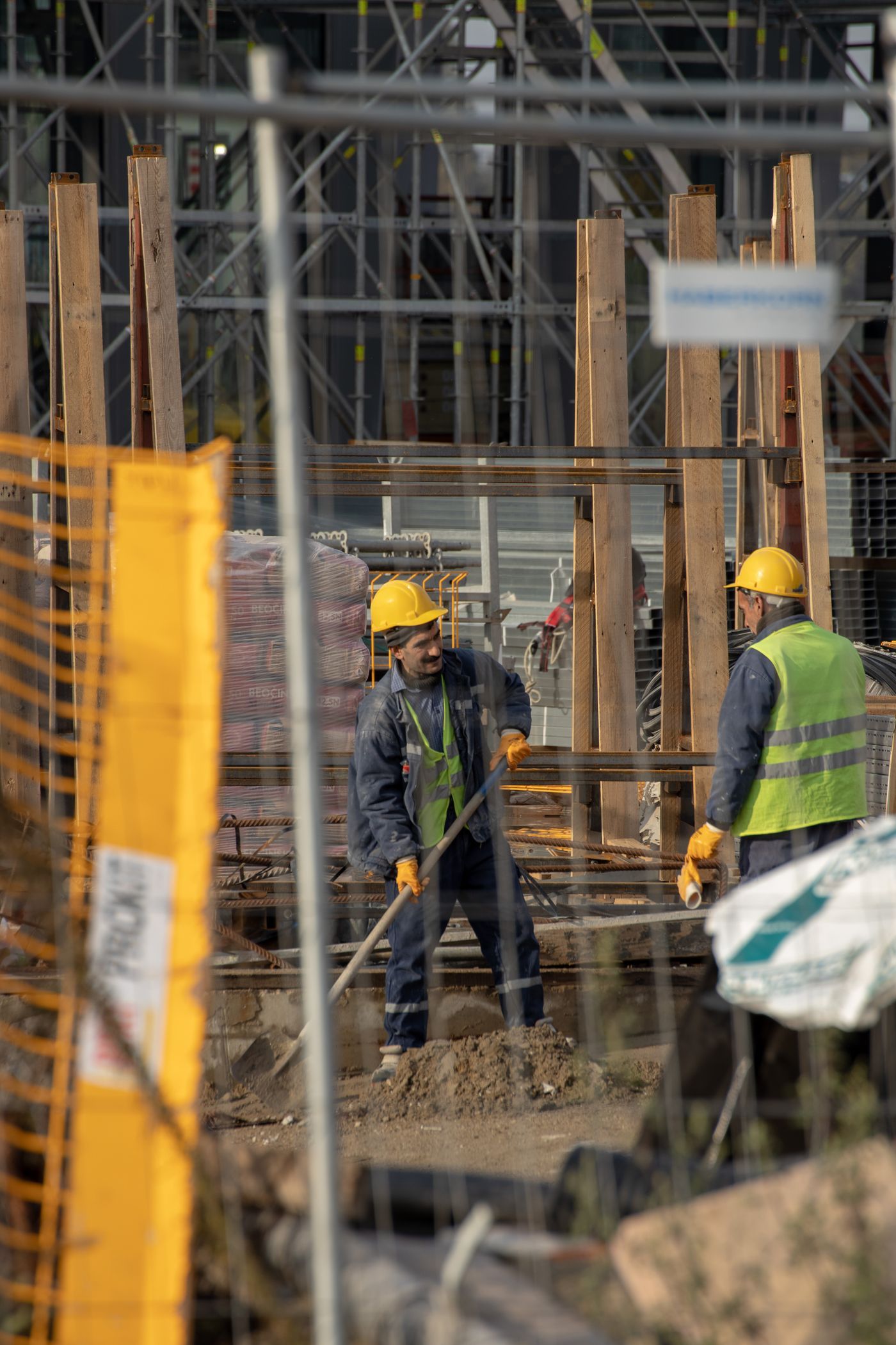 Construction workers carrying out work on an active site